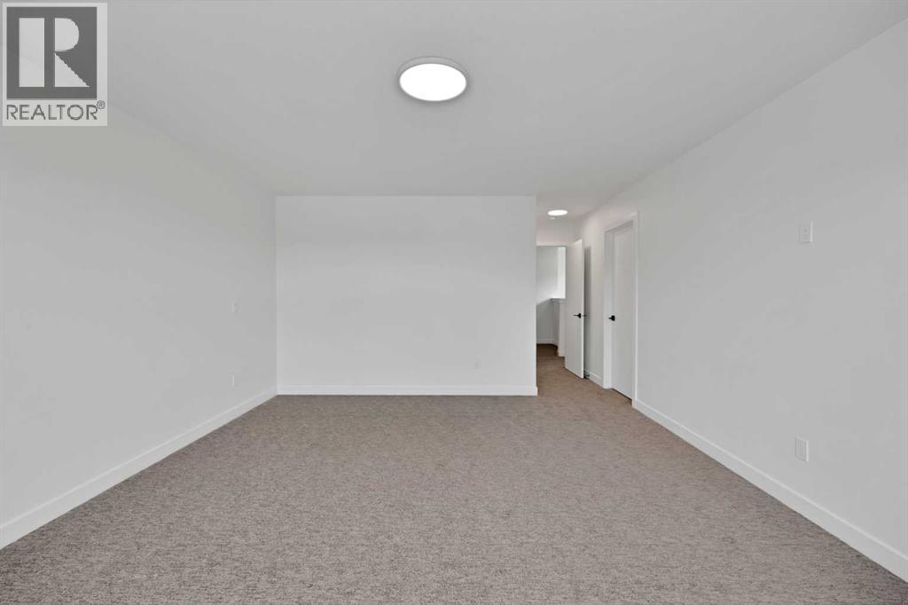 82 Heritage Circle, Cochrane, Alberta  T4C 3G9 - Photo 20 - A2304448