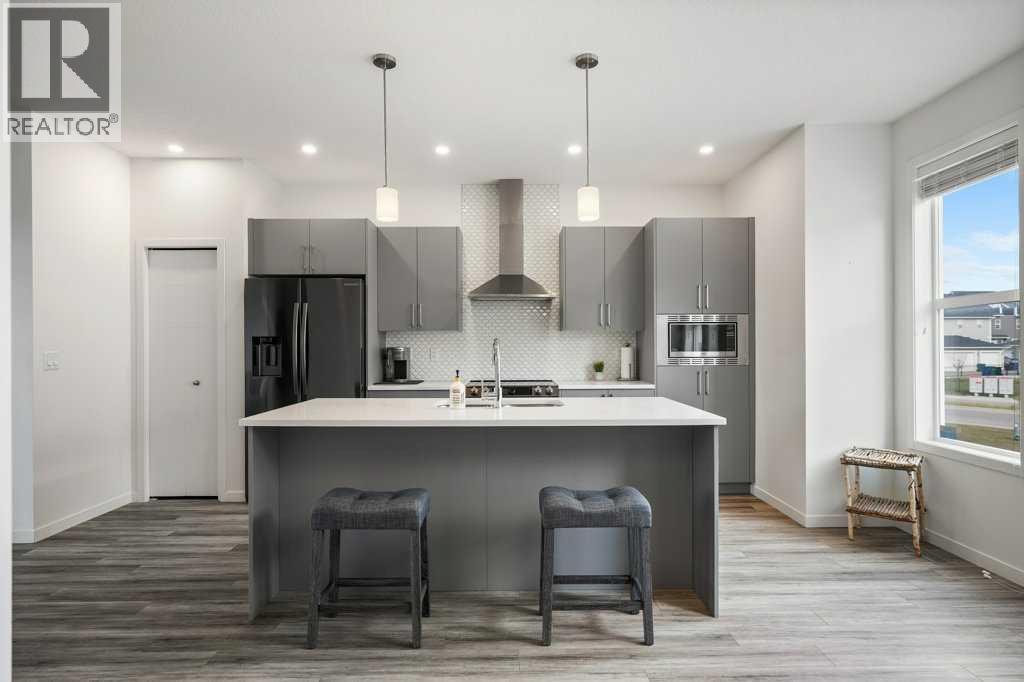 409 South Point Lane SW, Airdrie, Alberta  T4B 5G8 - Photo 5 - A2304977