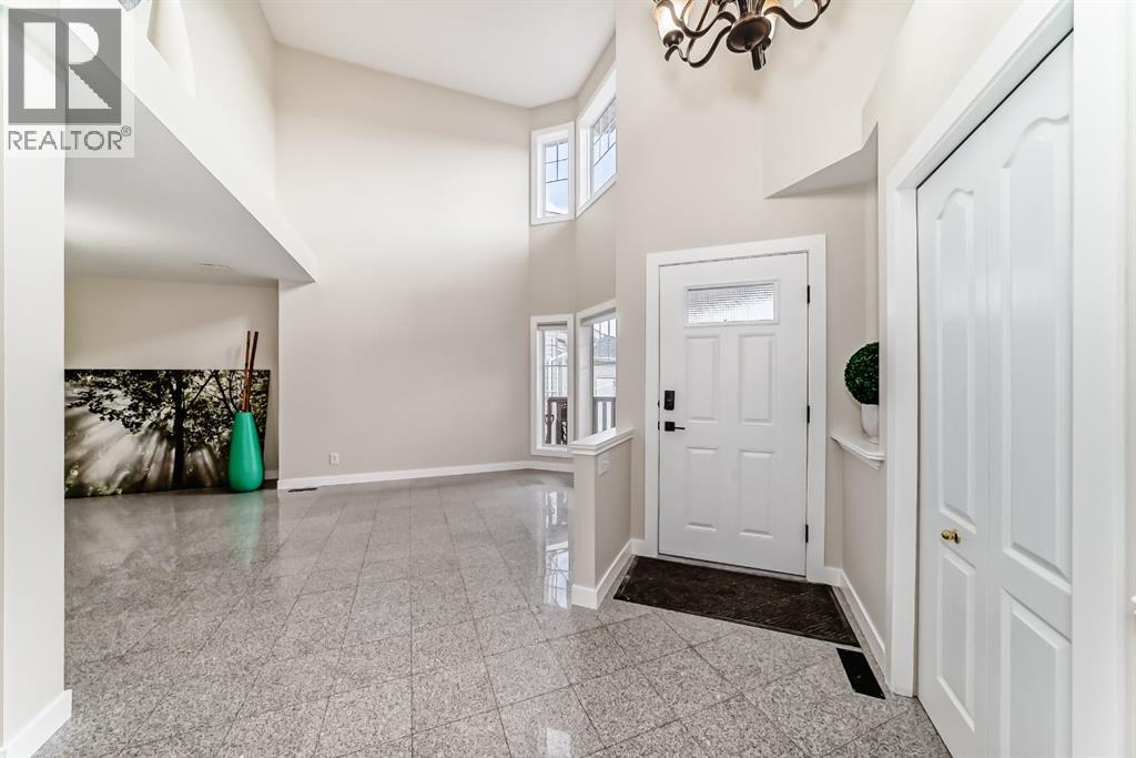 311 Rocky Ridge Cove NW, Calgary, Alberta  T3G 4K1 - Photo 4 - A2300845