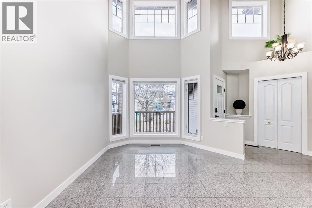 311 Rocky Ridge Cove NW, Calgary, Alberta  T3G 4K1 - Photo 6 - A2300845