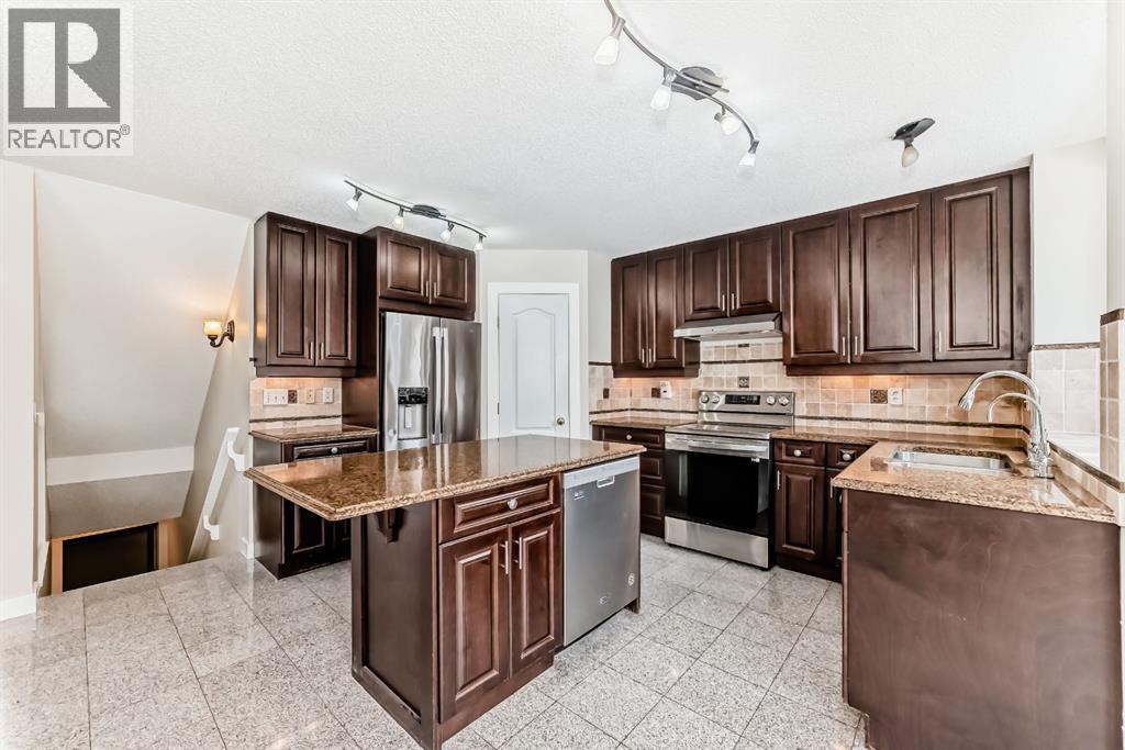 311 Rocky Ridge Cove NW, Calgary, Alberta  T3G 4K1 - Photo 9 - A2300845