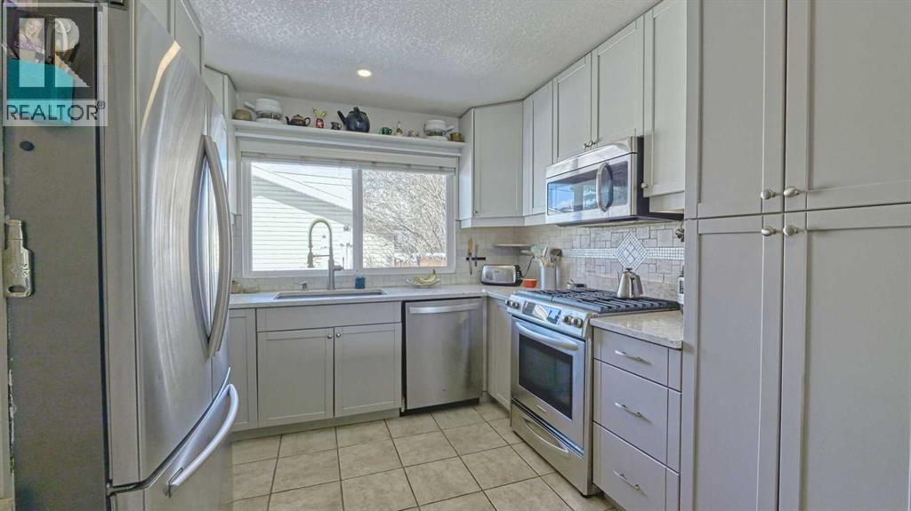 64 Midglen Drive SE, Calgary, Alberta  T2X 1G7 - Photo 10 - A2302754