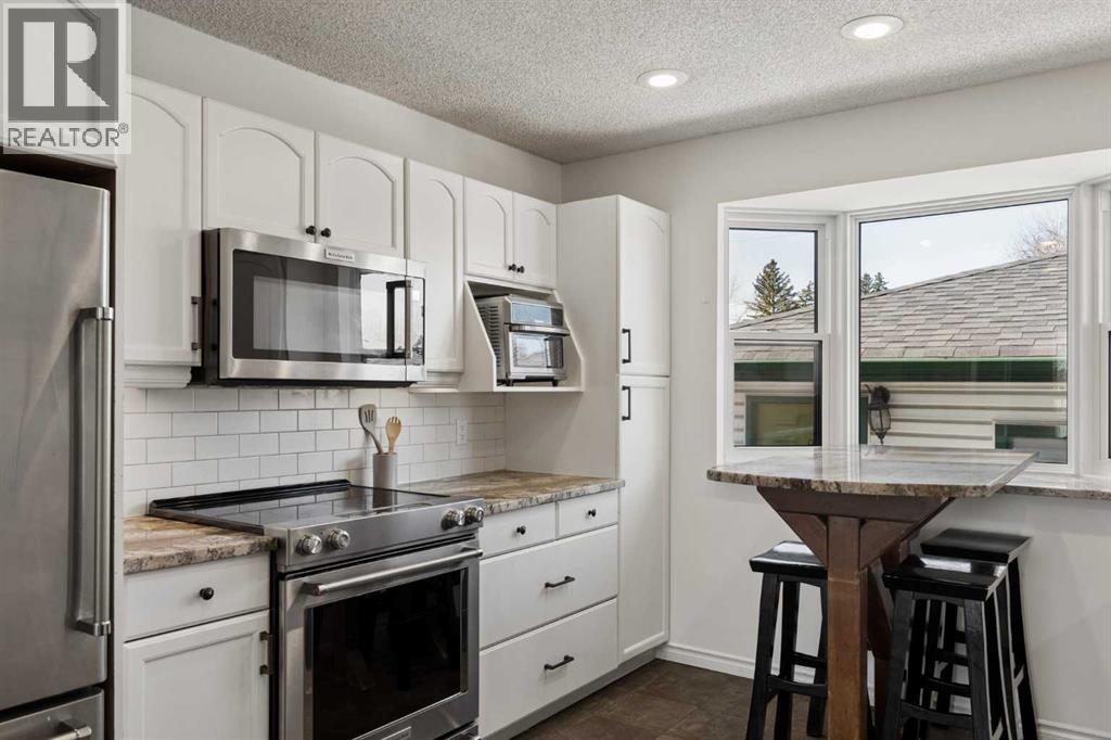 8011 Huntington Street Ne, Calgary, Alberta  T2K 5B8 - Photo 12 - A2303394