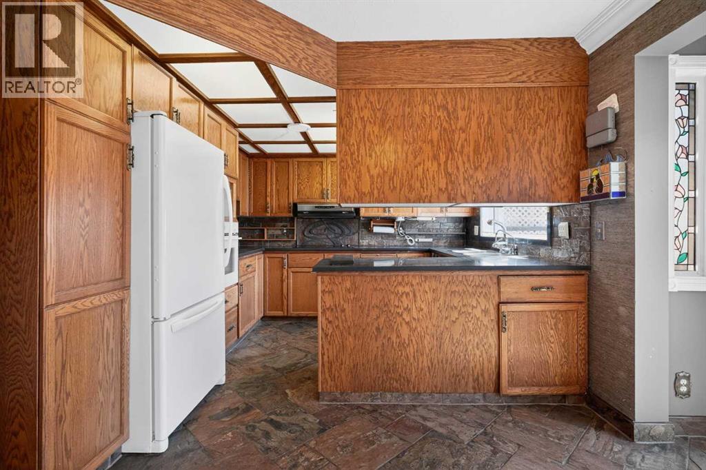 67 Woodstock Road SW, Calgary, Alberta  T2W 5W3 - Photo 9 - A2304479