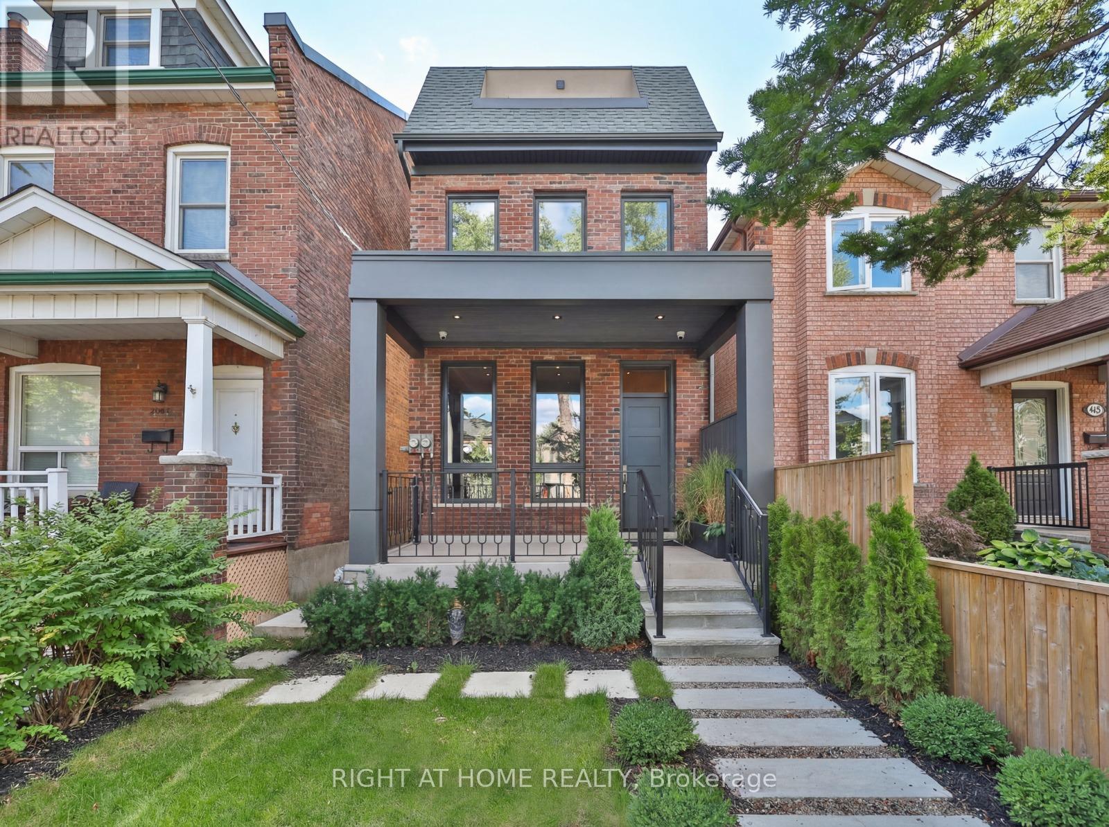 In the heart of the city, yet set within a quiet, tree-lined neighbourhood, this fully renovated 4,200 square foot residence offers the best of both worlds. A rare two-storey laneway home at the rear adds exceptional flexibility and long-term value.Every inch has been reimagined with modern finishes and timeless design, creating a home that feels both sophisticated and welcoming. High ceilings and light-filled spaces are enhanced by east and west exposures, delivering natural sunlight throughout the day.The interiors showcase refined craftsmanship throughout, from the custom-designed kitchen with premium appliances and millwork to versatile living spaces ideal for both everyday life and entertaining. The top floor is dedicated to a private primary retreat with a spa-inspired ensuite, heated floors, a library or lounge area, and two private balconies. All bathrooms throughout the home feature heated floors.The lower level offers high ceilings, heated floors, a bright living area, kitchenette, full bathroom, and an additional bedroom, ideal for guests or extended family.At the rear, the two-storey laneway home features its own entrance, secure garage, and a bright one-bedroom plus den, two-bathroom suite with kitchen. Ideal for multi-generational living, a private workspace, guest accommodations, or short-term rental income, the laneway suite offers a rare opportunity to significantly offset monthly carrying costs.Steps to acclaimed restaurants, neighbourhood parks, cafes, grocery stores, and transit, this exceptional property brings together luxury, location, and lifestyle in perfect harmony. (id:48254)