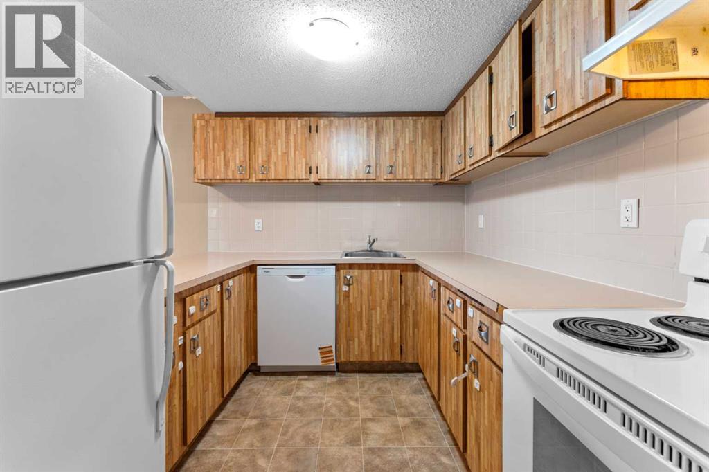 1202, 2200 Woodview Drive Sw, Calgary, Alberta  T2W 3N6 - Photo 4 - A2305307