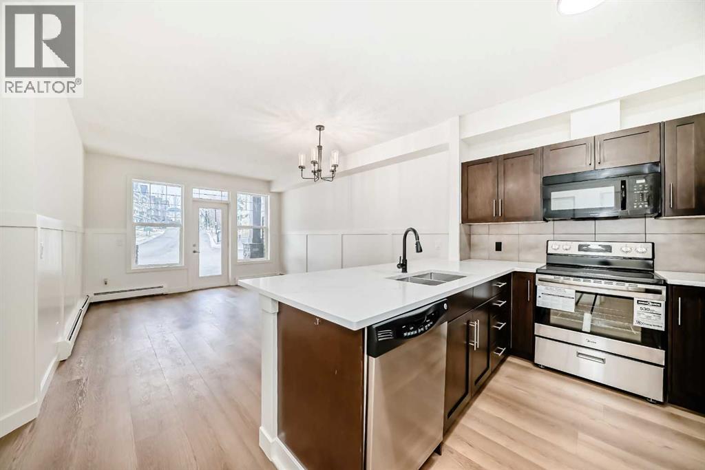 101, 22 Panatella Road NW, Calgary, Alberta  T3K 0V4 - Photo 1 - A2290846