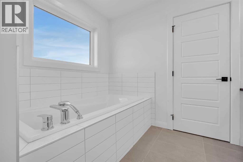 154 Northern Lights Crescent, Langdon, Alberta  T0J 1X2 - Photo 29 - A2290853