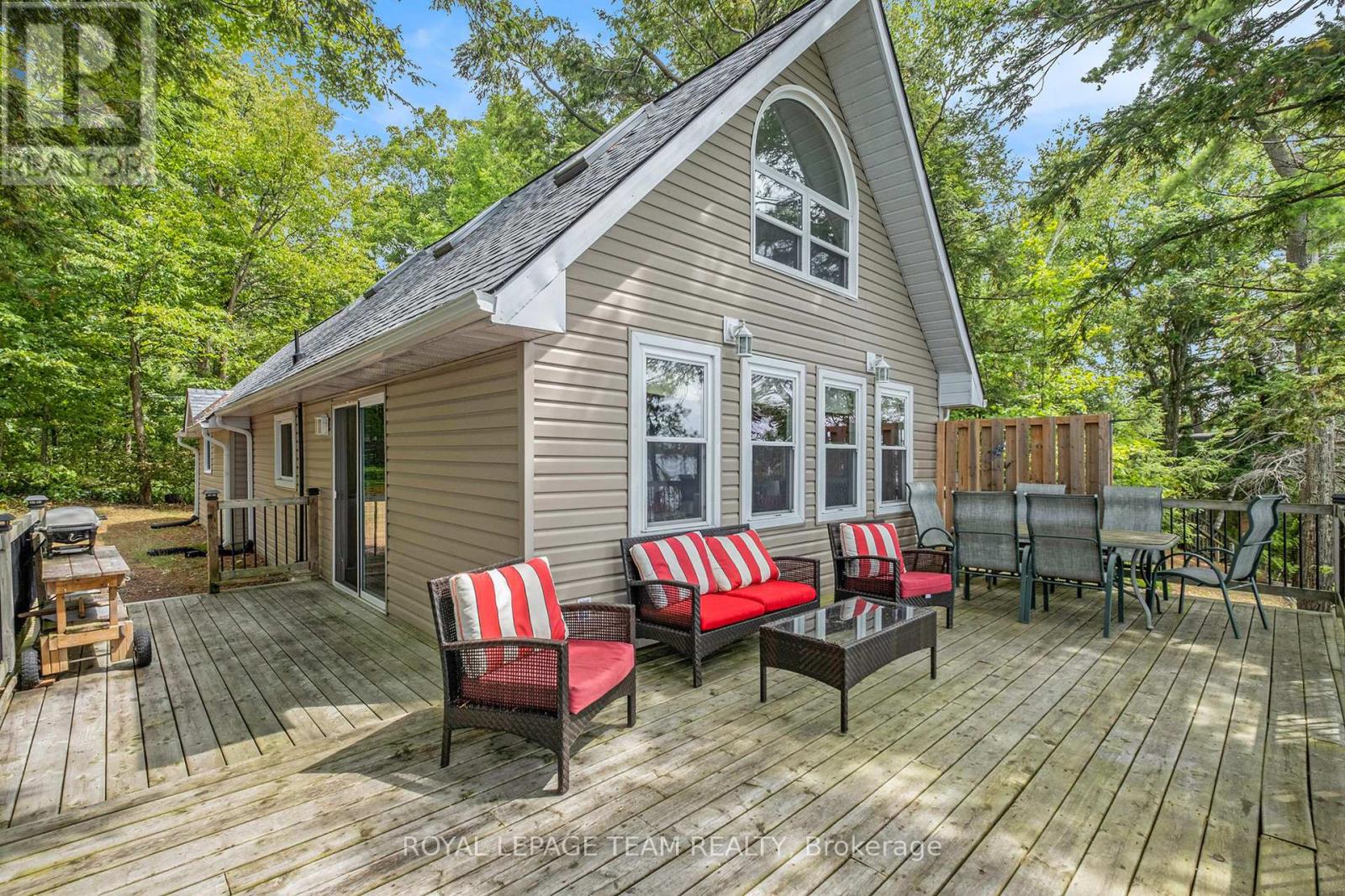 Spectacular water views on sought-after Otter Lake! Experience the best of lakeside living in this charming retreat. Perched perfectly, its full western exposure captures stunning sunset views. This property invites you to soak up nature from the comfort of an expansive deck overlooking pristine Otter Lake.  Enjoy lakeside living on your oversized dock, complete with built in kayak, SUP or canoe storage. Perfect for summer fun by day, or star gazing at night. This property provides deep water for weed free swimming, fishing and boating right off the dock. Inside, you'll find a bright, inviting living room framed by picture windows, offering breathtaking water vistas year-round. With 3 comfortable bedrooms, and 1.5 baths, this home is ideal for family living or a weekend getaway. Spacious main floor bedroom features direct access to the outdoors. A WETT-certified pellet stove ensures cozy nights, while the oversized garage provides ample space for vehicles, storage, or hobbies. Guests will love the charming log bunkie, offering a private and rustic escape. Recent updates include new roof shingles (2023), giving you peace of mind for years to come. Road is plowed in the winter when required. Whether you're looking for a permanent residence or a lakeside retreat, this property delivers the perfect blend of comfort, charm, and outdoor beauty. (id:48254)