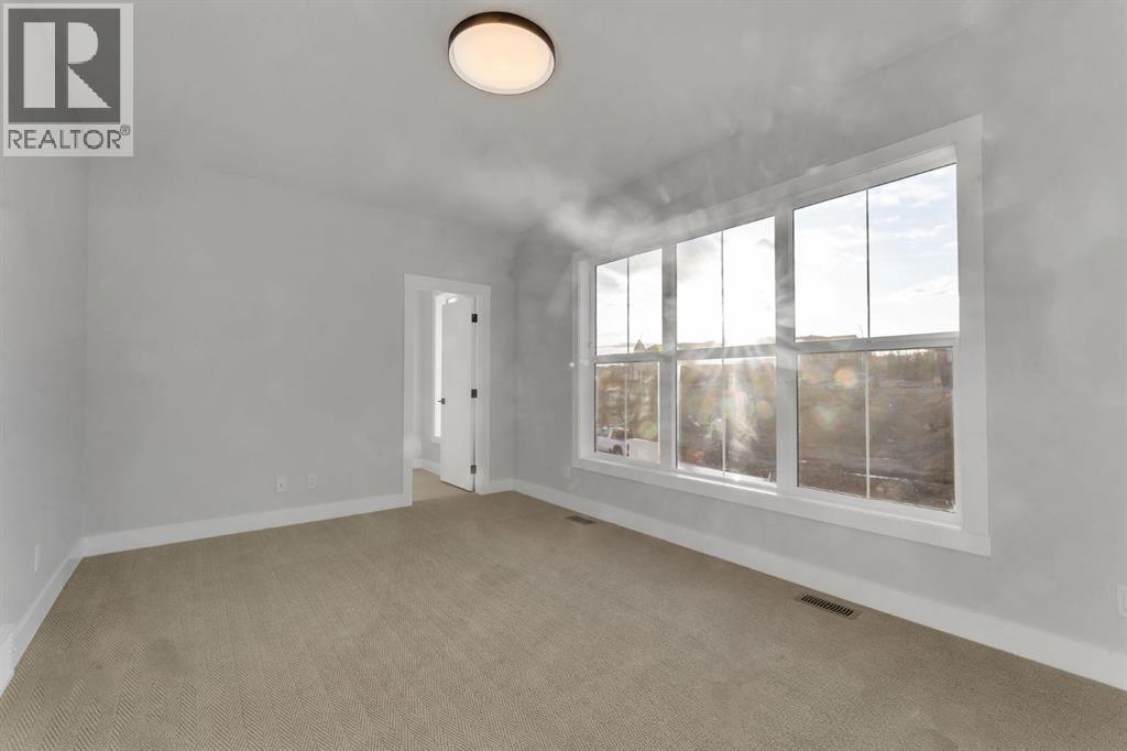 28 Spring Creek Point Sw, Calgary, Alberta  T3H 6E2 - Photo 35 - A2305464