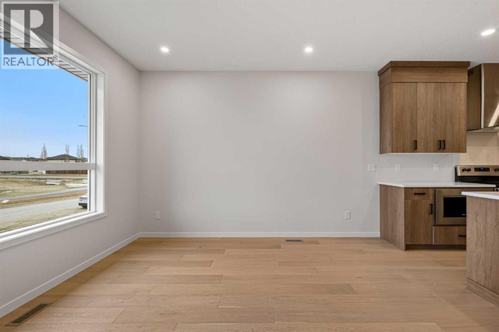 117 Bridgeport Gate, Chestermere, Alberta  T1X 3E5 - Photo 5 - A2285498