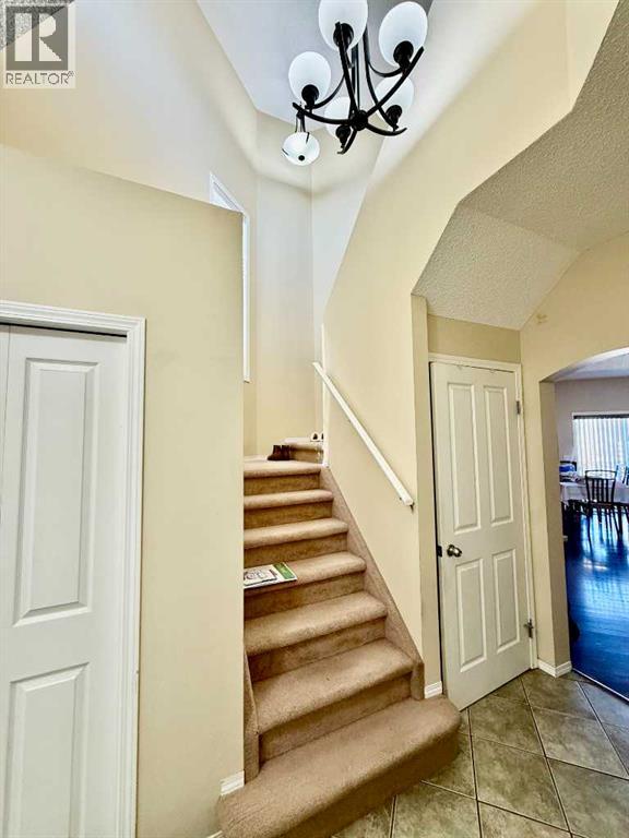 13 Tuscany Ridge Mews NW, Calgary, Alberta  T3L 3B7 - Photo 4 - A2303363