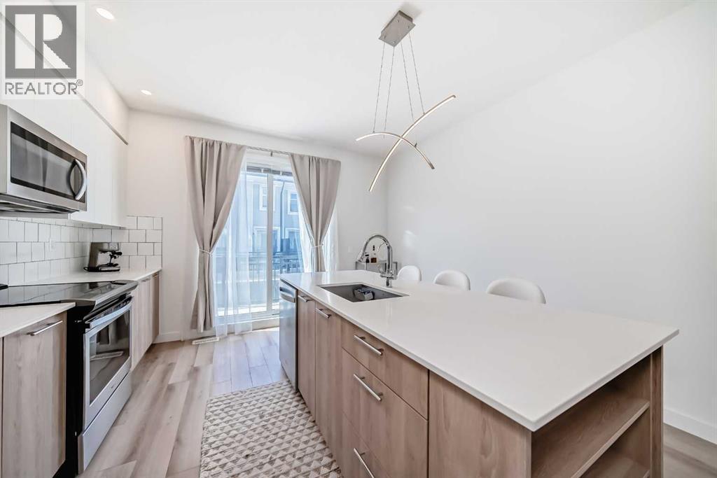 871 Belmont Drive Sw, Calgary, Alberta  T2X 4P2 - Photo 11 - A2306048