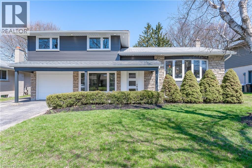 WELCOME TO 34 BRADLEY! This beautifully renovated side split has been re-imagined and is ready for you to be its next owner.  The open concept main floor is an entertainers dream featuring a huge kitchen with new cabinets, stainless steel appliances, quartz counter tops, and a massive waterfall island.  There's also new vinyl flooring throughout and brand new sliding doors leading to your oversized back yard.  The bedrooms are all generous in size, and you'll love the new cheater ensuite with glass shower.  The lower level has been redesigned to provide a new den/home office, a mud room and a full 3pc bathroom with glass shower.  As you walk  into the basement you'll be greeted with another full bathroom, a large bedroom, and a walk-up to the backyard.  All windows and doors have been updated, along with new pot lights inside and out, new vinyl siding, new gutters and a new electrical panel (ALL RENO'S and UPDATES COMPLETED IN 2022).  The home is also located in beautiful Stanley Pak, on a mature tree-lined street and close to school, shopping, HWY 401, Highway 7/8, walking trails, Chicopee Ski Hill, and many other amenities.  Call your favourite realtor and book your private showing today. (id:48254)
