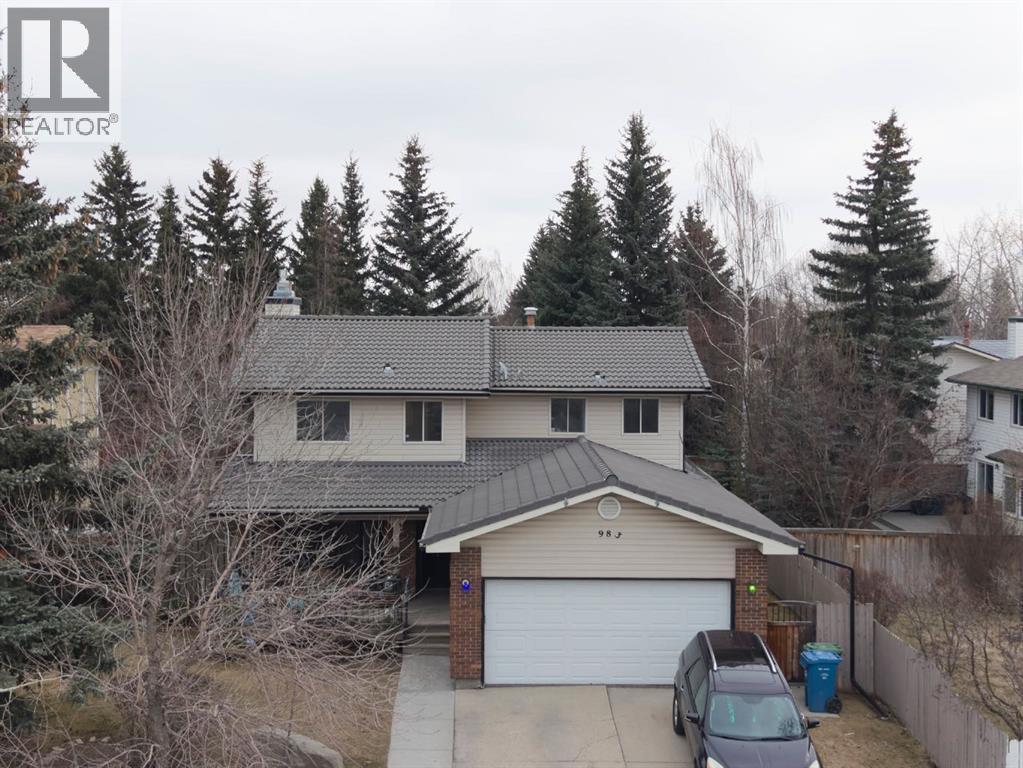 983 Woodbine Boulevard SW, Calgary, Alberta  t2w 4a7 - Photo 1 - A2301604
