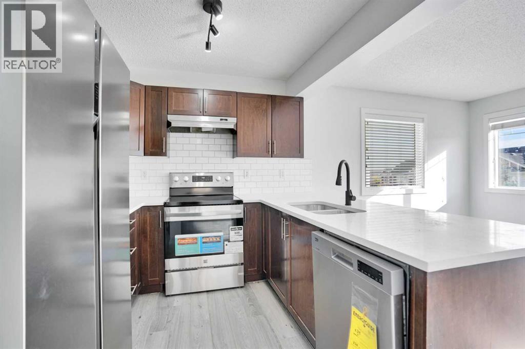 137 Pantego Lane NW, Calgary, Alberta  T3K 0T1 - Photo 4 - A2292494