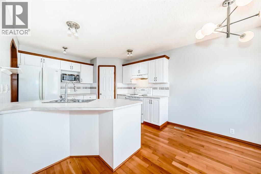 128 Harvest Park Road NE, Calgary, Alberta  T3K 4H9 - Photo 9 - A2305181