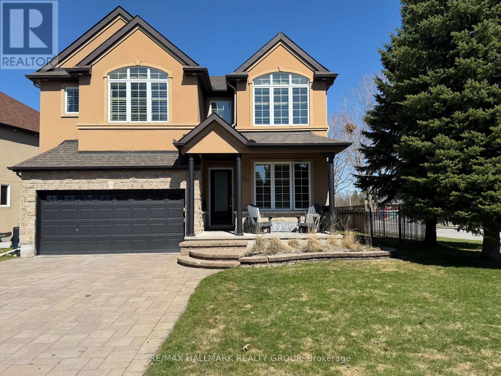 Moffatt Farm offers the best of all worlds-parks, riverfront access, scenic walking paths, and effortless connectivity across Ottawa. Set on an oversized lot along a quiet, family-friendly street, this former Cardel model home blends space, natural light, and timeless design with a true lifestyle focus. The versatile main floor is thoughtfully designed for modern living, featuring a formal living room ideal as a home office, a dining space with coffered ceilings (currently styled as a den), and a warm, open family room anchored by a gas fireplace. The spacious kitchen is both functional and inviting-offering ample prep space for everyday living or entertaining-paired with a bright breakfast area overlooking the backyard. California shutters throughout add a refined, cohesive finish. A striking custom circular staircase leads to the upper level, where an impressive front-facing bonus room adds flexibility, alongside four well-proportioned bedrooms. The primary suite is a private retreat, complete with a five-piece ensuite and walk-in closet, while a second full bath with double sinks and convenient second-floor laundry complete the level. The professionally finished lower level is a true extension of the home-flooded with natural light, elegant fireplace and designed for entertaining or extended living. A stylish wet bar featuring KitchenAid café fridge drawers anchors the space, ideal for hosting, movie nights, or relaxed evenings. The lower level also offers a dedicated bedroom area and a full three-piece bath with heated floors, creating a comfortable and functional space for guests. Thoughtful exterior upgrades further enhance everyday living and include fully fenced yard, interlock stone front and back has lawn irrigation system. A rare opportunity to enjoy space, comfort, and lifestyle in one of Ottawa's most desirable communities. (id:48254)