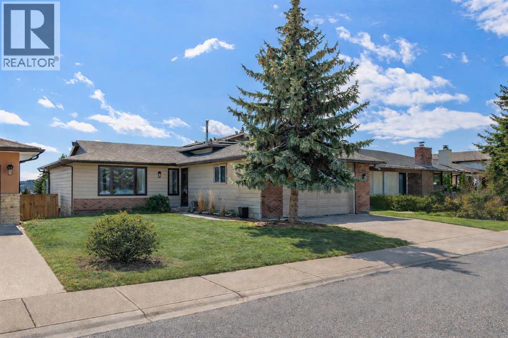 7715 67 Avenue NW, Calgary, Alberta  T3B 4B2 - Photo 1 - A2299625