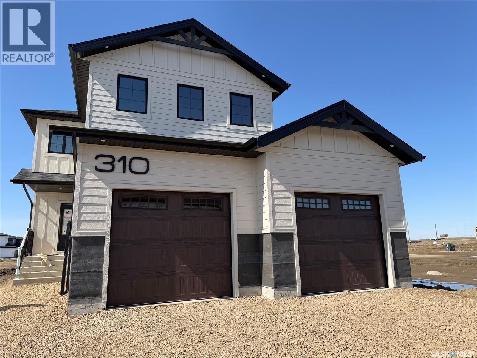 310 Traeger Manor, Saskatoon, Saskatchewan  S7V 1Z4 - Photo 1 - SK034475