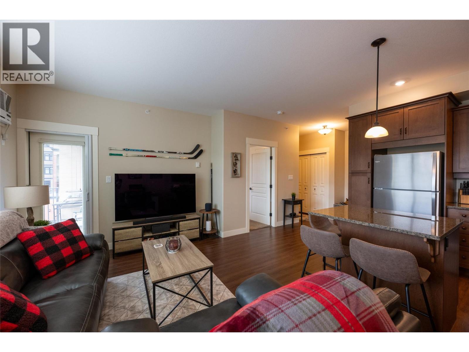 Calling first-time homebuyers and investors to check out this bright and refreshed 1-bedroom, 1-bathroom modern condo located in The Residence! Centrally-located and situated on the top floor with a desirable west-facing exposure, this home enjoys plenty of natural light and beautiful sunsets. The open kitchen, dining and living area with access to the covered balcony is perfect for everyday entertaining. This move-in ready unit has been updated with fresh paint throughout and new carpet in the bedroom, creating a clean and comfortable space. The home also features the convenience of in-unit laundry, air-conditioning and a dedicated secure, underground parking stall providing easy and comfortable year-round living. This unit has been a successful rental and investment, making it a great opportunity for someone looking for a proven income property or an easy first purchase in a convenient location close to amenities, shopping, and Thompson Rivers University. Vacant and easy to show. Quick possession possible. Book your showing today! (id:48254)