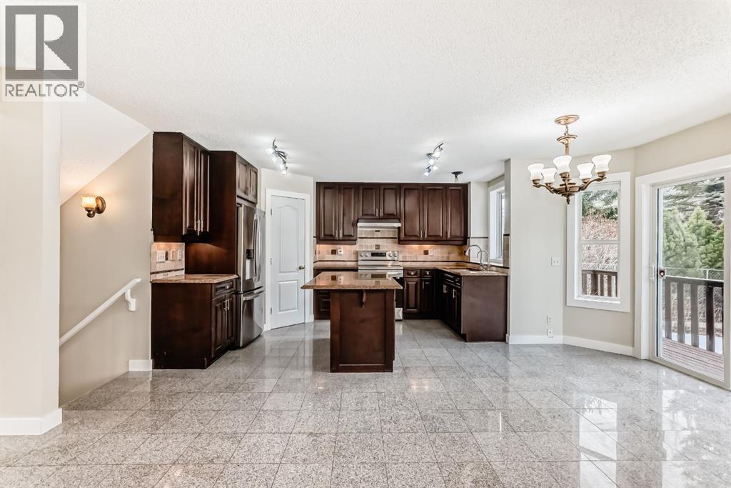311 Rocky Ridge Cove Nw, Calgary, Alberta  T3G 4K1 - Photo 10 - A2300845