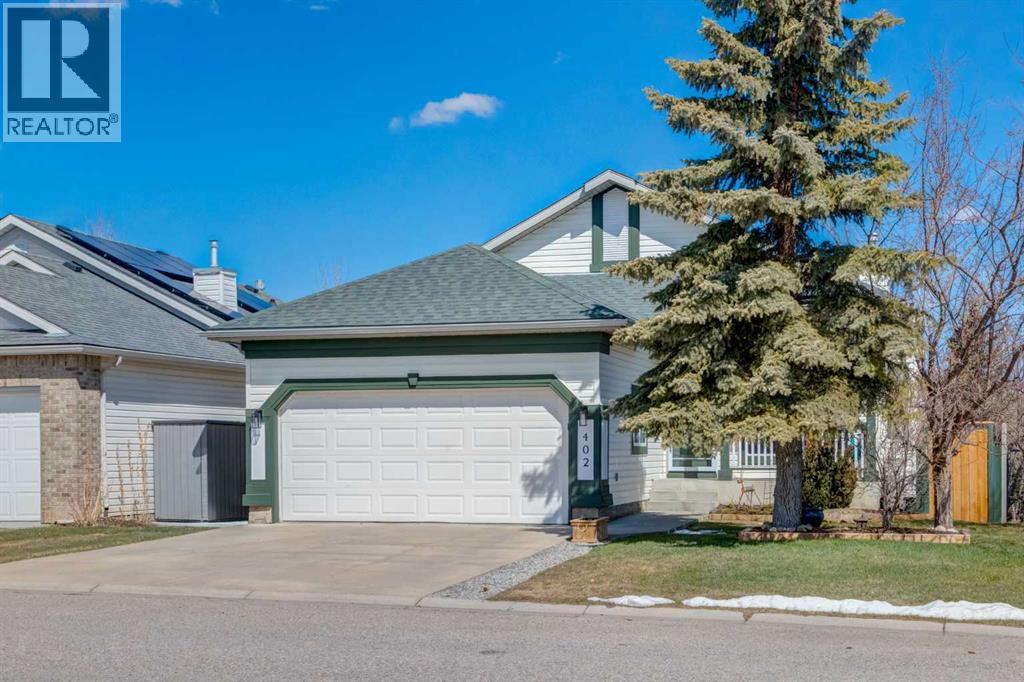 402 Rocky Ridge Cove Nw, Calgary, Alberta  T3G 4J6 - Photo 2 - A2306917