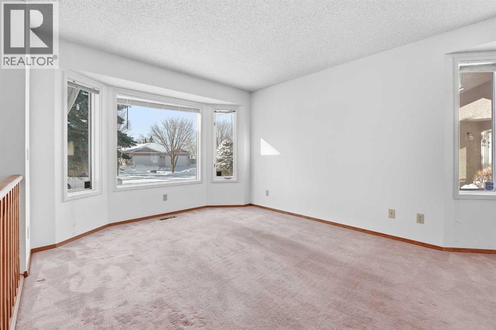 12 Arbour Cliff Close NW, Calgary, Alberta  T3G 3W8 - Photo 4 - A2276284