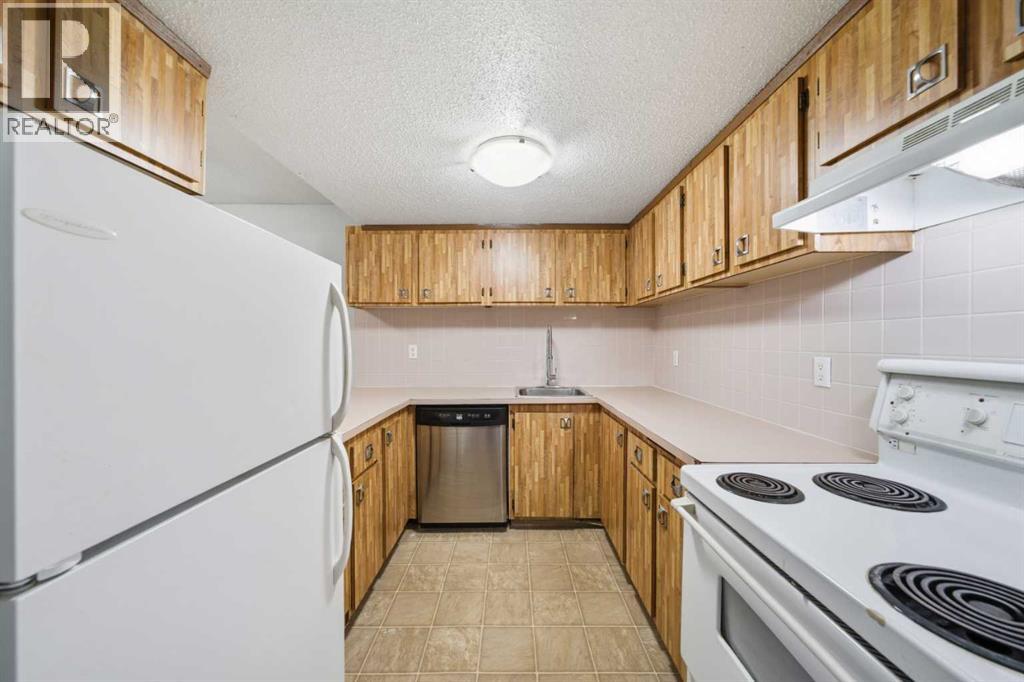 306, 2200 Woodview Drive Sw, Calgary, Alberta  T2W 3N6 - Photo 7 - A2306365