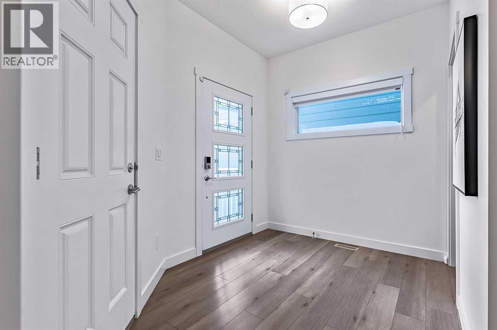 882 Bluerock Way SW, Calgary, Alberta  T2Y 0S5 - Photo 3 - A2293006