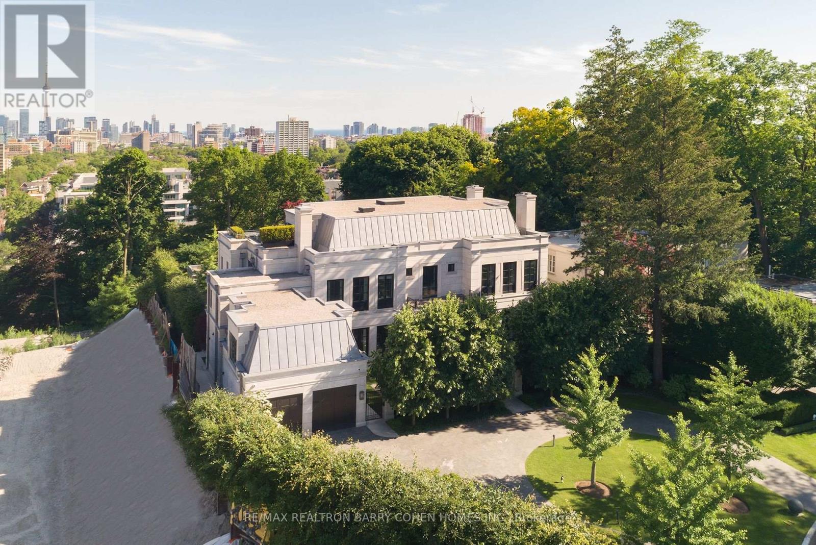 Perched Above The City Skyline. One Of The Most Architecturally Significant And Breathtaking Estates In Toronto, Discretely Nestled At The End Of A Cul-De-Sac. This Luxurious Residence Offers Stunning Views At Every Turn And Is Just A Short Walk To The Historical Casa Loma Landmark, Sir Winston Churchill Park, And All Other Amenities. This Estate Boasts Over 15,200 Square Feet Of Meticulously Designed Living Space, Crafted By Its Owner With The Finest Materials And State-Of-The-Art Innovation And Technology. Accommodate Eleven Cars With An Interior Parking Space Complete With Its Very Own Turntable And Car Wash. The Grand Main Level Features Soaring 12-Foot Ceilings, A Private Elevator, And A Chef-Inspired Kitchen With A Walk-In Fridge And Spacious Butlers Pantry. The Sprawling Primary Suite Includes An Impressive Sitting Area And An Opulent 8-Piece Marble Bath Fit For Royalty, While All Family Bedrooms Feature Ensuites. The Third Floor Offers State-Of-The-Art Gym/Spa Amenities With Dry And Wet Saunas, A Terrace, And A Hot Tub. The Lower Level Boasts A Cinematic Home Theatre, Kidzone Playroom, Catering Kitchen, Staff Quarters, And Fully Automated Dual Wine Cellars. The Gated Residence Features An Indiana Limestone Faade, Heated Driveway, Walkways, And Rear Stone Terrace. Meticulously Landscaped Gardens Include Multiple Water Features, An Outdoor Kitchen, Lounging Areas, A Breathtaking Concrete Pool With An Automated Cover, An Outdoor Fire Pit, And A Separate Cabana With A Change Room And 3-Piece Washroom. This Contemporary Opulence Sets A New Standard Of Luxury Living, Offering An Unparalleled Lifestyle For The Discerning Buyer. (id:48254)