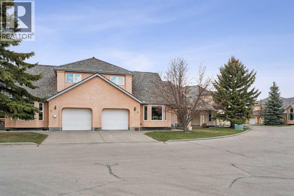 8, 26 Quigley Drive, Cochrane, Alberta  T4C 1M2 - Photo 3 - A2305379