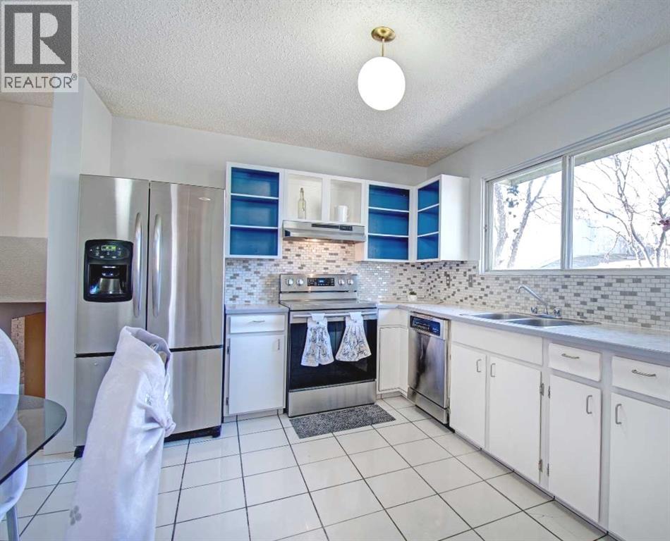 6307 Thornaby Way NW, Calgary, Alberta  T2K 5K8 - Photo 2 - A2292423