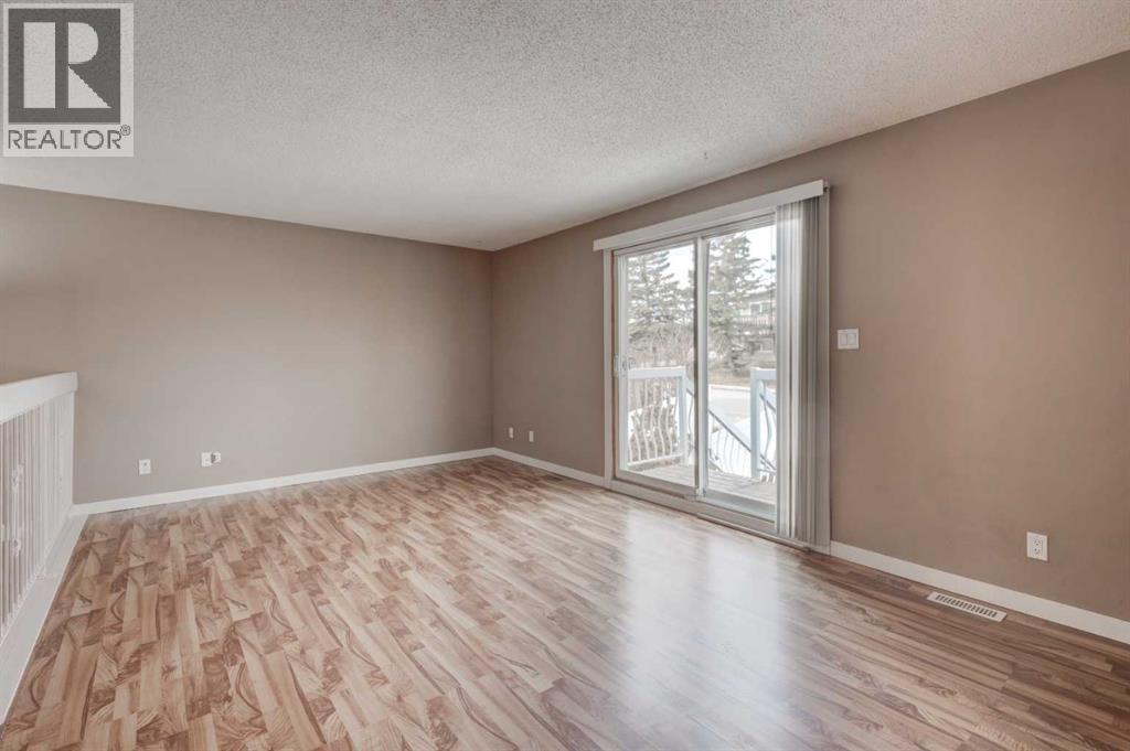11452 8 Street Sw, Calgary, Alberta  T2W 4J5 - Photo 5 - A2289821