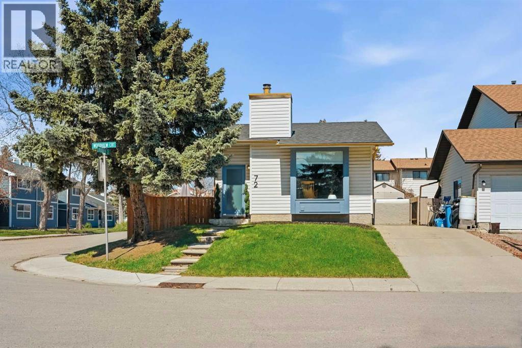 Set on a large corner lot at the start of a quiet cul-de-sac, this beautifully renovated home sits within walking distance of Fish Creek Park, schools, parks and everyday amenities. Thoughtful updates bring modern style into a warm, family-friendly layout with 3 bedrooms, 3 full bathrooms and a fully finished basement. Luxury vinyl plank flooring runs throughout the open main level for a clean, durable finish that suits busy everyday living. Gather in the living room by the focal fireplace while an oversized bayed window draws in natural light and additional pot lights brighten the space into the evening. Sleek, contemporary cabinetry gives the kitchen a polished feel, paired with stainless steel appliances, a gas cooktop, full-height storage and a raised breakfast bar for casual meals or conversation while cooking. Patio sliders in the dining area connect directly to the west-facing patio, making summer barbeques and outdoor dining easy. Unwind in the primary retreat, where trendy barn sliders open to a walk-in closet and a renovated ensuite featuring dual faucets and a luxurious full-body shower experience. The second bedroom stands out with a sculptural feature wall that brings texture and modern organic character. Everyday routines stay effortless in the 4-piece bathroom, finished with a clean, modern design that complements the home’s overall style. Downstairs, the fully finished lower level adds valuable flexibility with a huge rec room ready for movie nights, games, fitness, play or relaxed family time. A 3rd bedroom and another stylish full bathroom make the basement comfortable for guests, older children or extended household needs. Outside, the expansive patio overlooks a large fully fenced grassy yard where kids and pets can play securely. Seasonal items can stay tucked away in the shed and the extended front driveway adds convenient off-street parking. Woodbine Square, Safeway, Shoppers Drug Mart, local shops, transit, schools and Fish Creek Park pathway s are all within walking distance and  Stoney Trail, Costco and the inner city is easily accessible when the day takes you beyond the community. (id:48254)