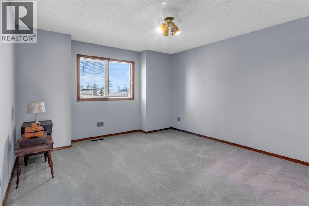 220 Woodbrook Mews Sw, Calgary, Alberta  T2W 4P8 - Photo 25 - A2298872