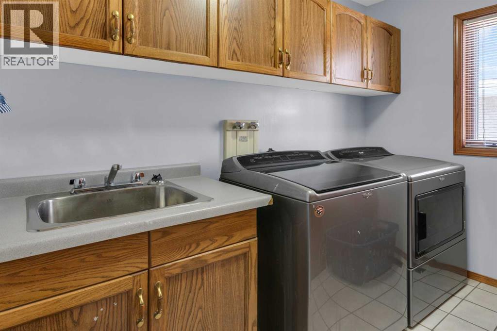 220 Woodbrook Mews Sw, Calgary, Alberta  T2W 4P8 - Photo 20 - A2298872