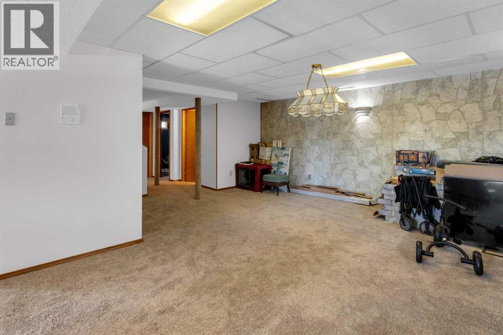 220 Woodbrook Mews Sw, Calgary, Alberta  T2W 4P8 - Photo 31 - A2298872