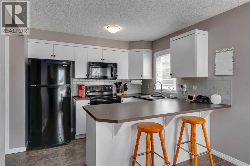 2 Windstone Lane SW, Airdrie, Alberta  T4B 0N7 - Photo 6 - A2303488