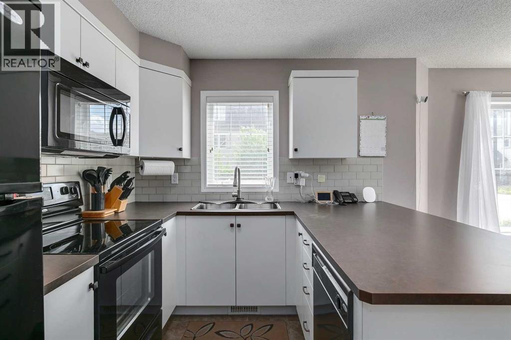 2 Windstone Lane SW, Airdrie, Alberta  T4B 0N7 - Photo 7 - A2303488