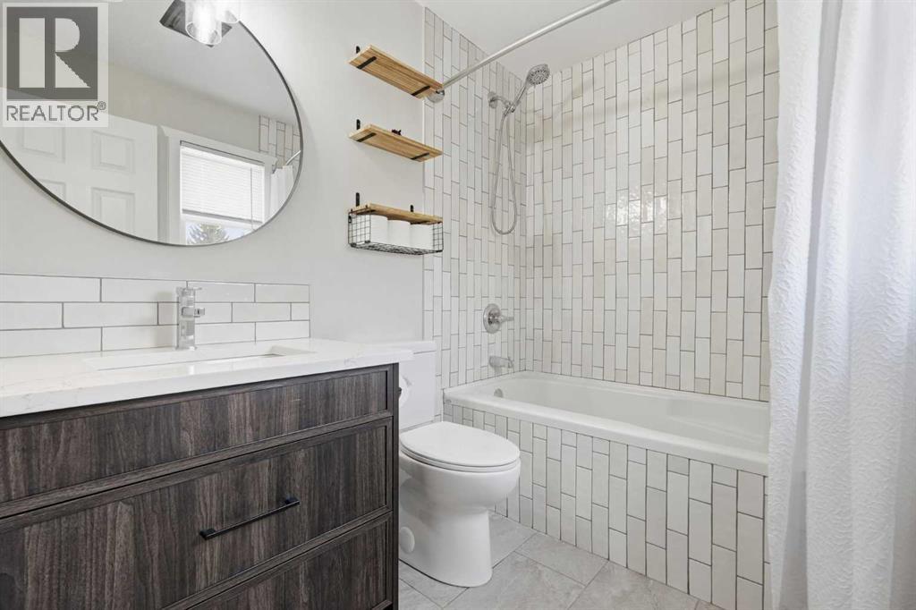 71 Woodfield Drive SW, Calgary, Alberta  T2W 3T3 - Photo 20 - A2307737