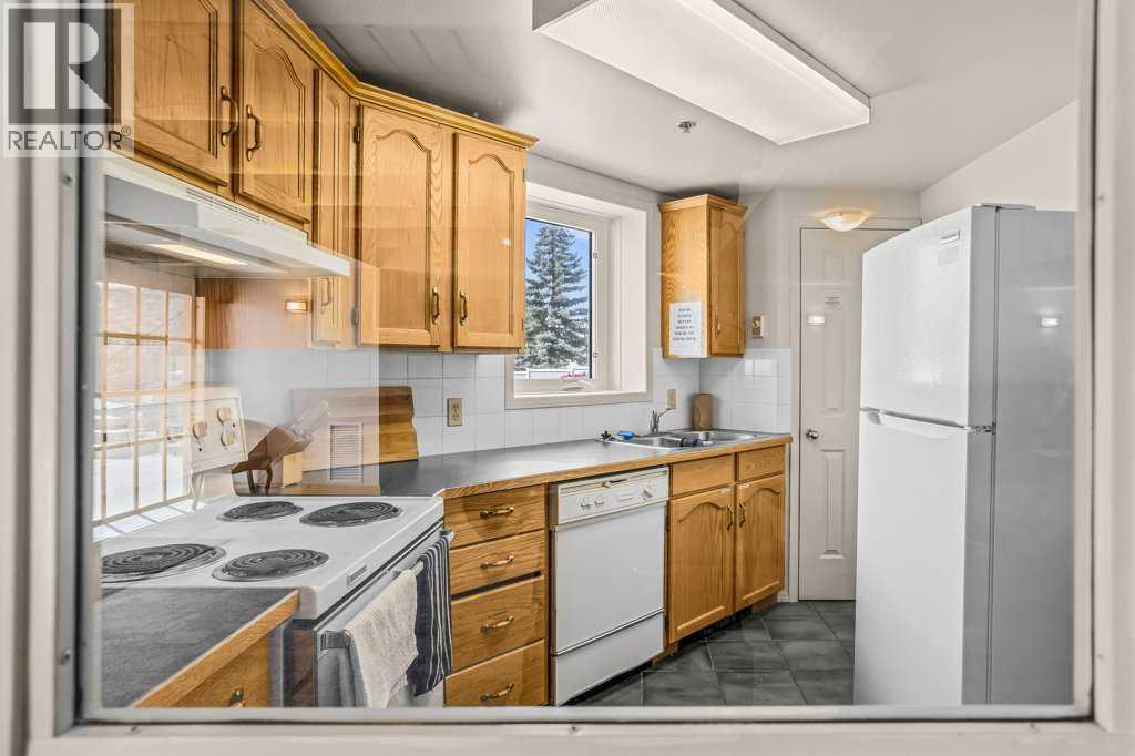 310, 1080c Cougar Creek Drive, Canmore, Alberta  T1W 2X9 - Photo 37 - A2308351