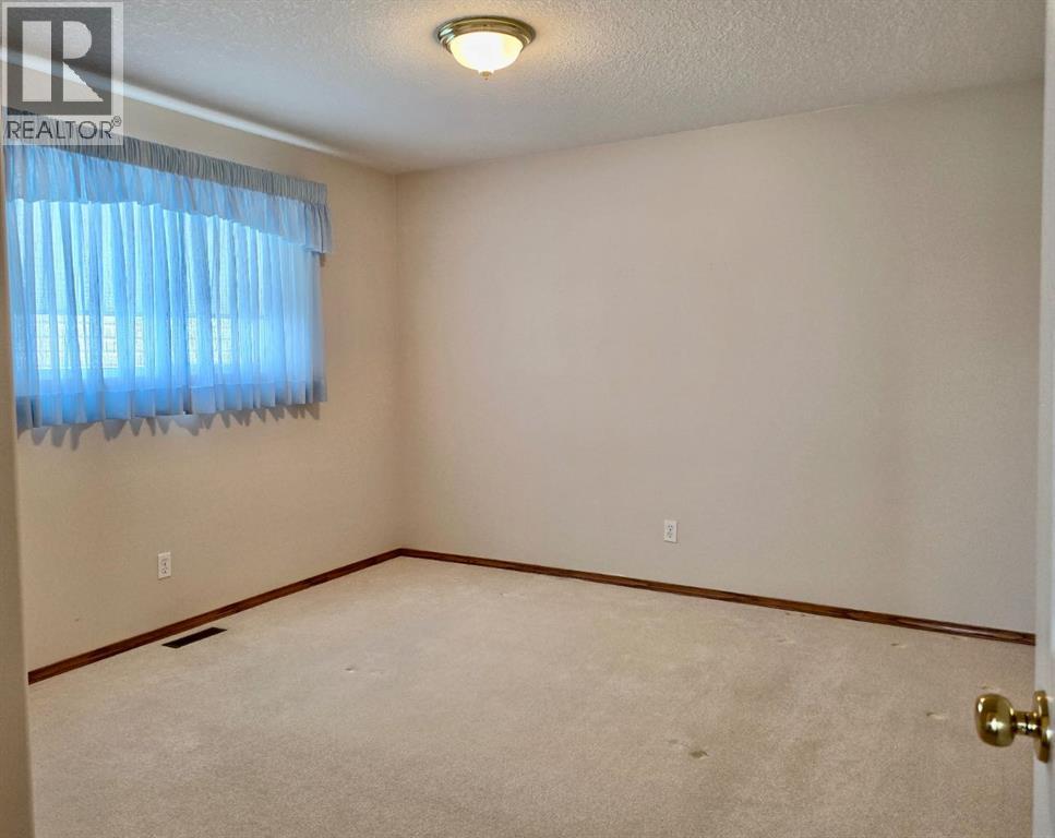 915 Highland Green Drive Nw, High River, Alberta  T1V 1V8 - Photo 11 - A2303971