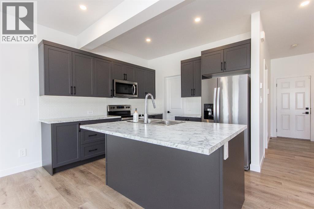 66 Henderson Crescent, Penhold, Alberta  T0M 1R0 - Photo 5 - A2290633