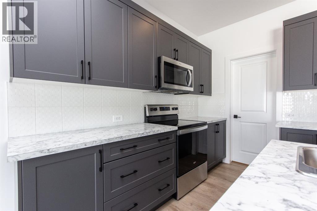 66 Henderson Crescent, Penhold, Alberta  T0M 1R0 - Photo 7 - A2290633
