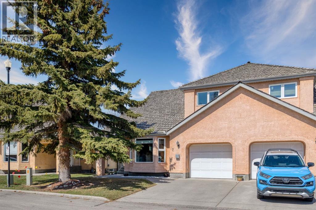 7, 26 Quigley Drive, Cochrane, Alberta  T4C 1M2 - Photo 1 - A2299032
