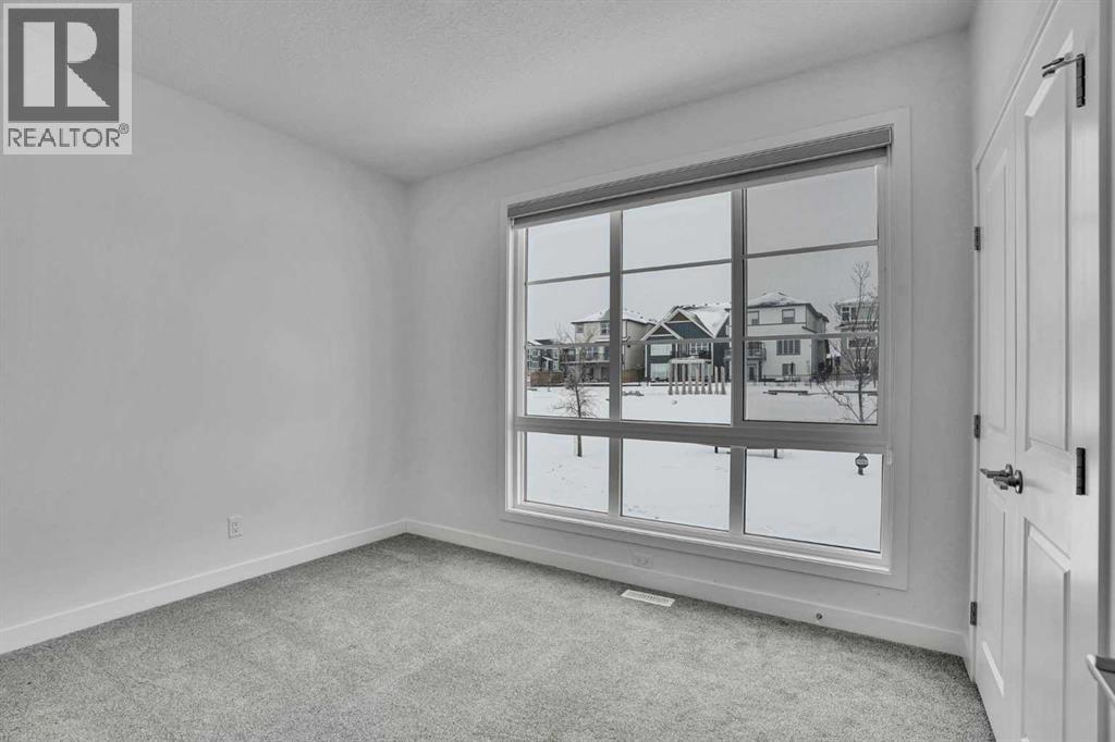 26 Amblehurst Path NW, Calgary, Alberta  T3P 1W8 - Photo 4 - A2297433