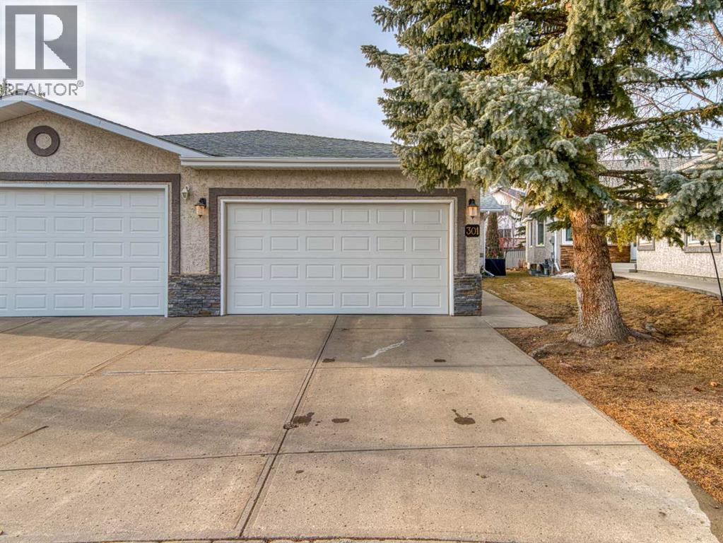 301 Arbour Cliff Close NW, Calgary, Alberta  T3G 3W8 - Photo 2 - A2284425