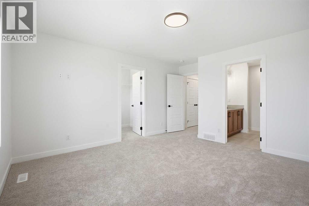 201 Bridgeport Gate, Chestermere, Alberta  T1X 3E2 - Photo 25 - A2304307