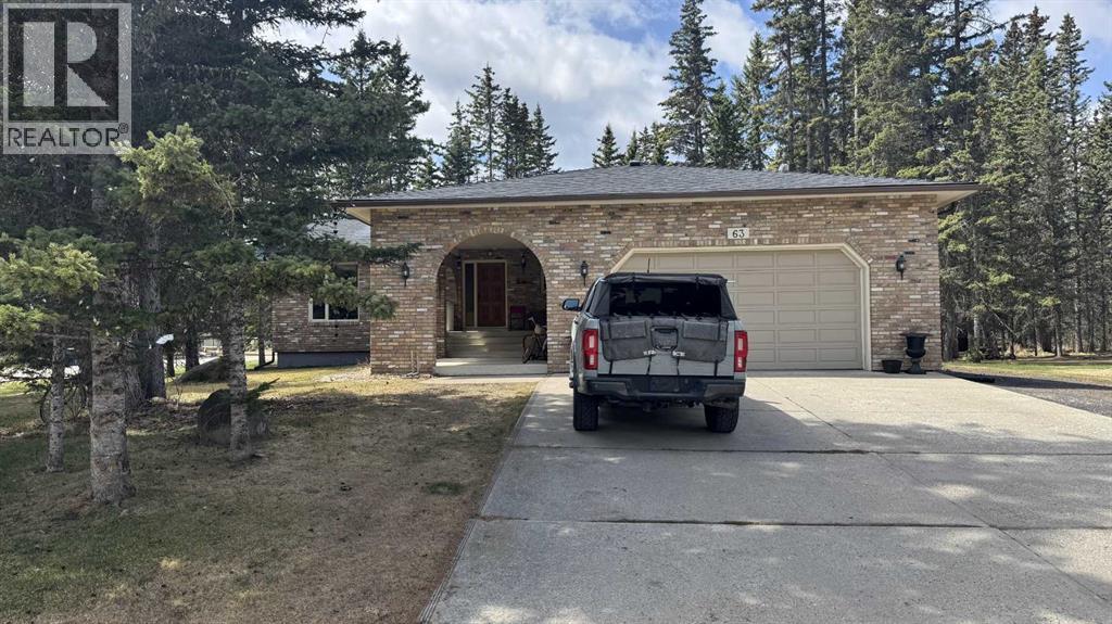 63,  Wolf Drive, Rural Rocky View County, Alberta  T3Z 1A3 - Photo 2 - A2309403